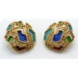 A pair of 18ct gold and enamel ear clips. The earrings having applied enamel decoration