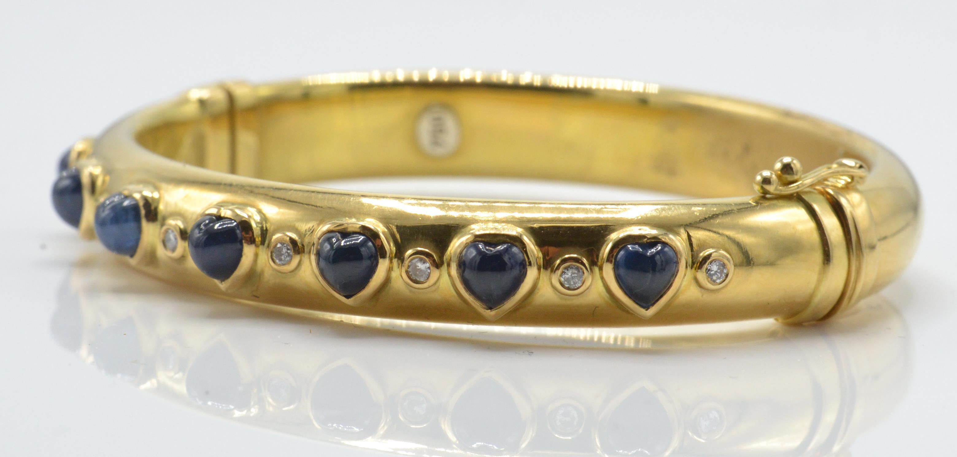 An 18ct gold sapphire and diamond bangle. The bangle set with heart shaped sapphire cabochons - Image 3 of 5