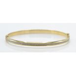 A Hallmarked 9ct White & Yellow Gold Bangle