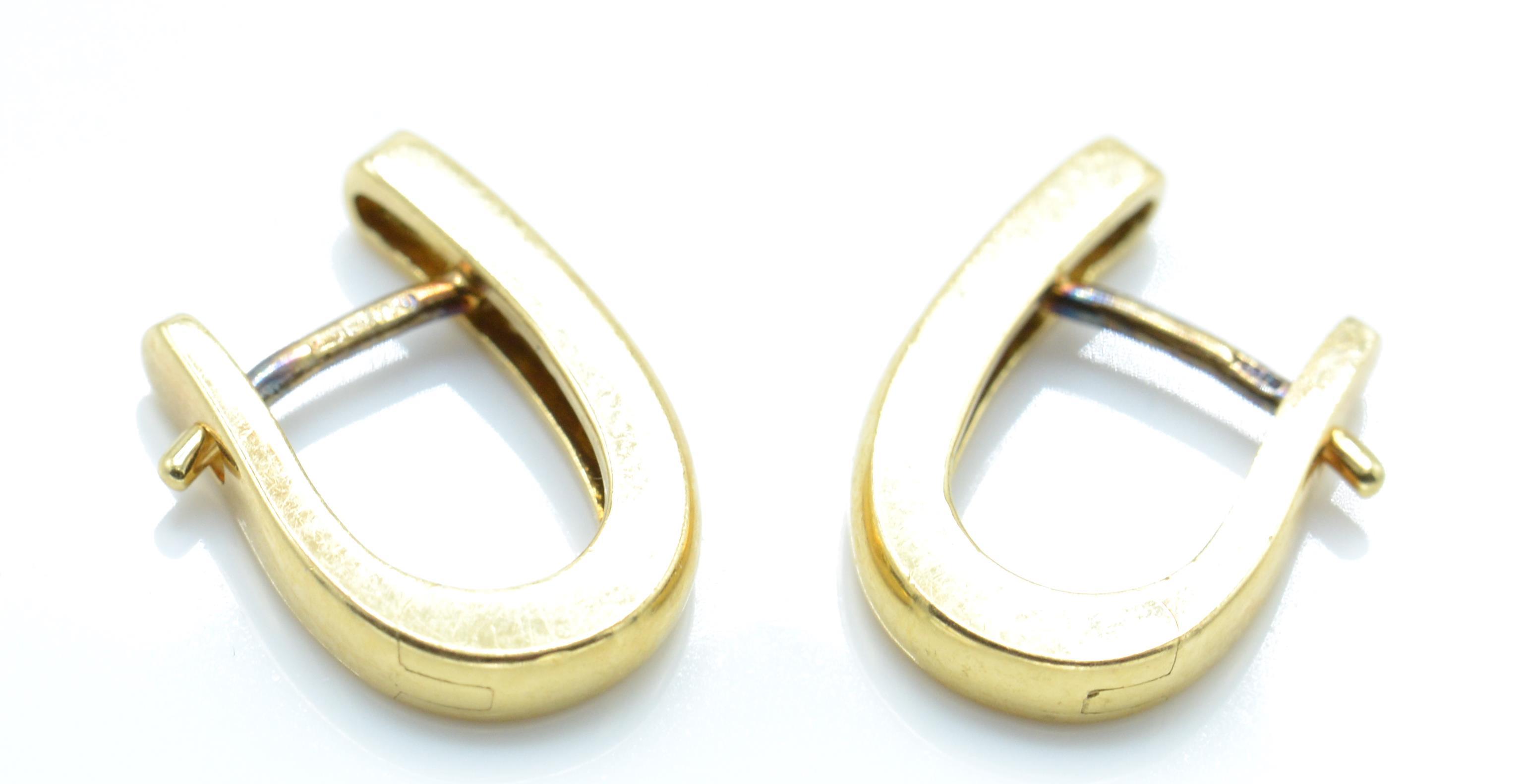 A pair of hallmarked 18ct gold and diamond earrings. - Image 2 of 3