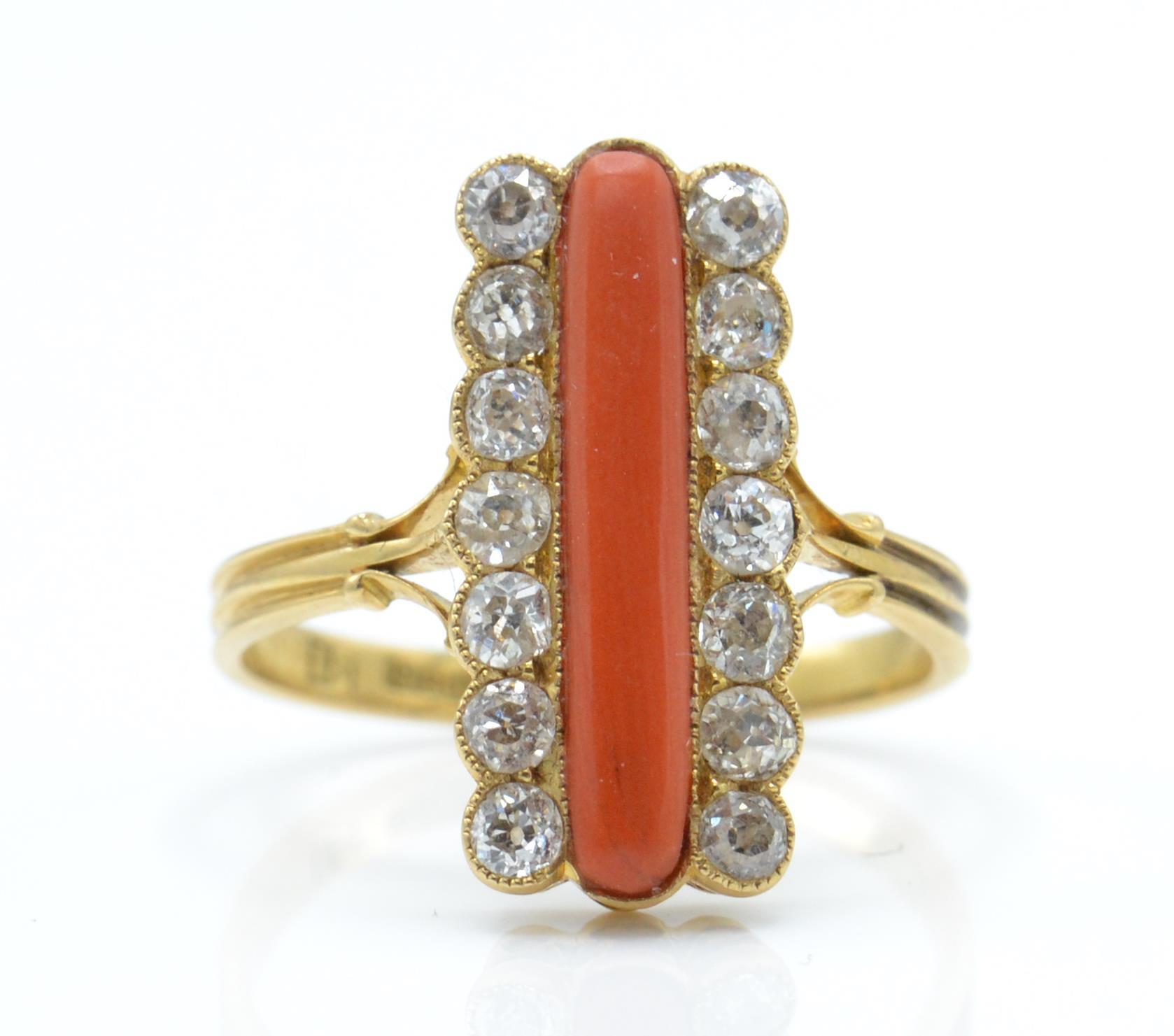 An 18ct gold 19th century coral and diamond ring. The ring having a central cabochon of coral