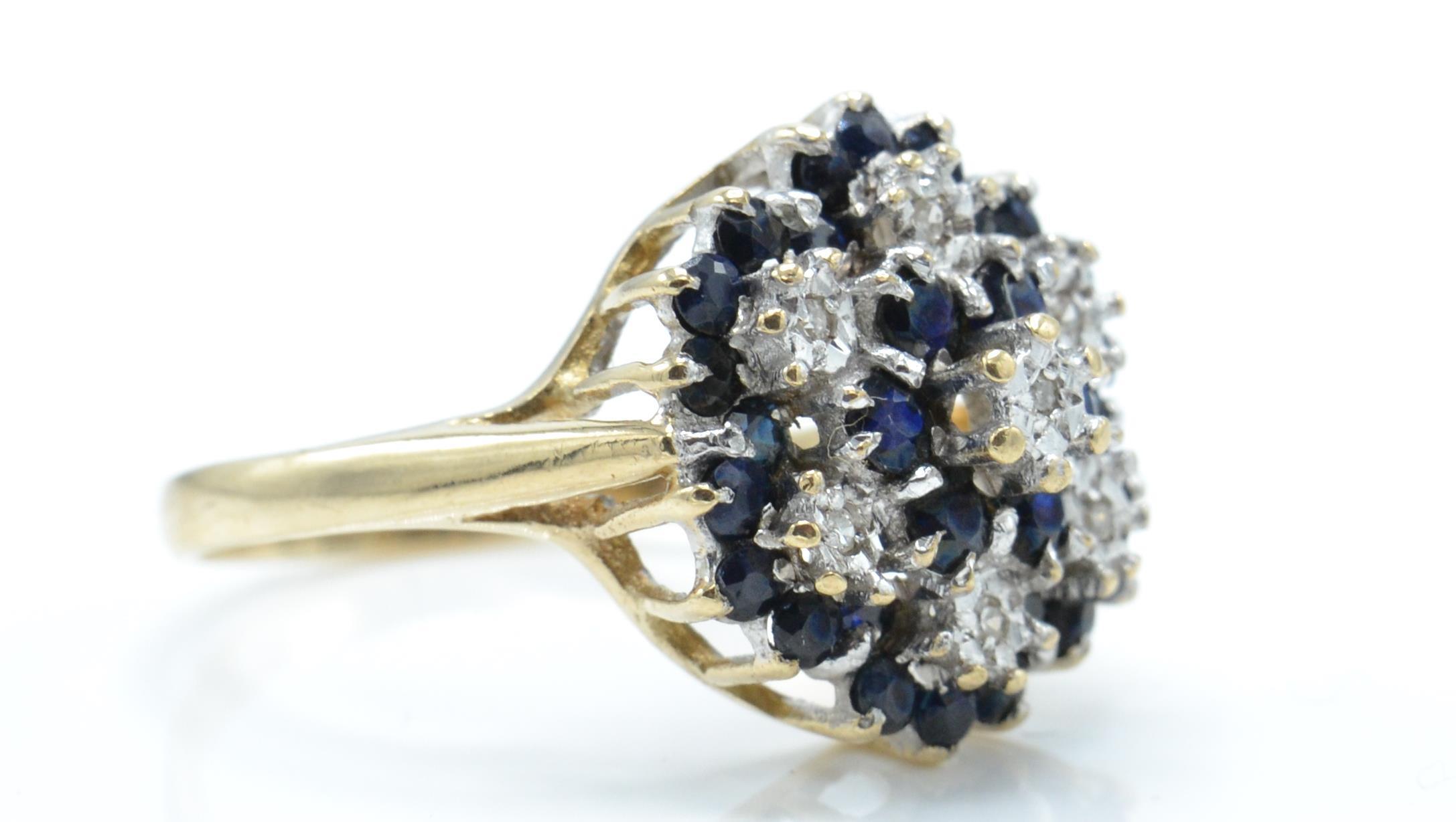 A hallmarked 9ct gold sapphire and diamond cluster ring. - Image 3 of 4