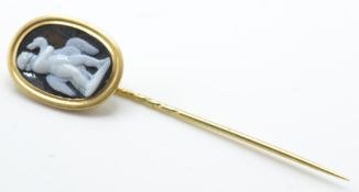 An antique gold cameo stickpin. The stickpin set with a cameo depicting a boy with a swan  -
