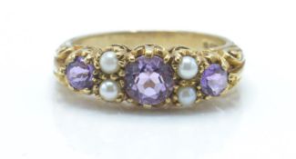 A hallmarked 9ct gold amethyst and pearl ring