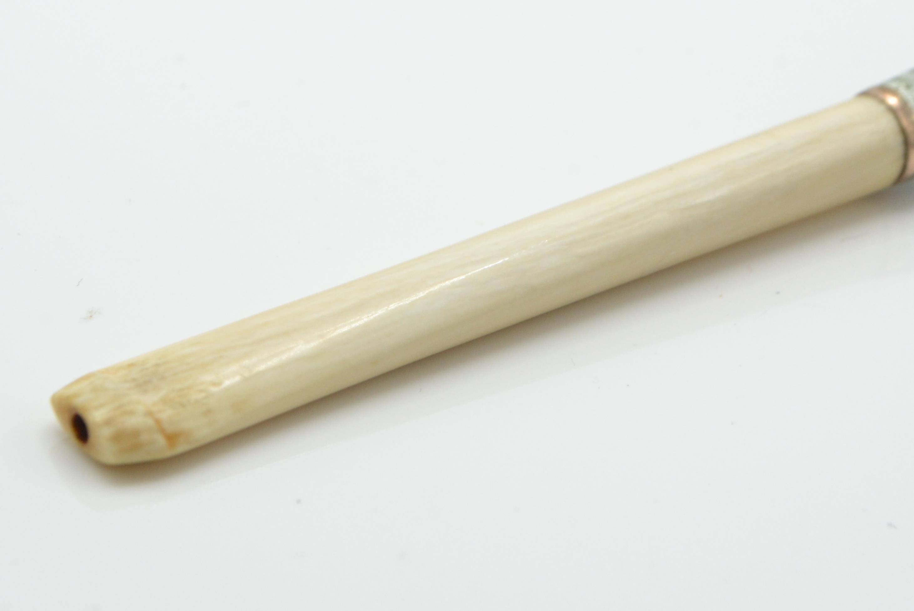 A 1930's Art Deco guilloche enamelled ivory cigarette holder. The ivory neck with enamelled - Image 5 of 5