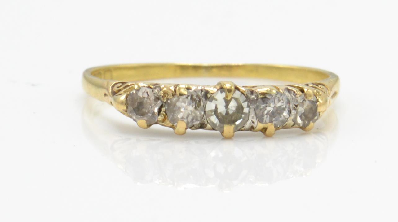 A hallmarked 18ct gold 5 stone diamond ring