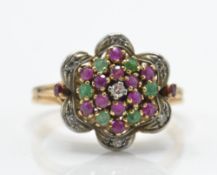 A gold ruby and diamond cluster ring.