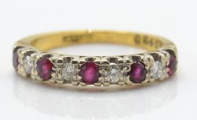 An 18ct gold ruby and diamond band ring. The ring set with alternating ruby and diamonds