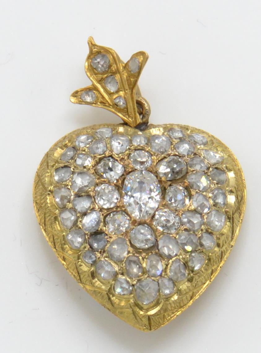 An antique Glad and diamond heart pendant. The pendant in the form of a heart encrusted with rose