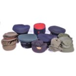 UNIFORMS AND FANCY DRESS - A COLECTION OF ASSORTED MILITARY RELATED HATS.