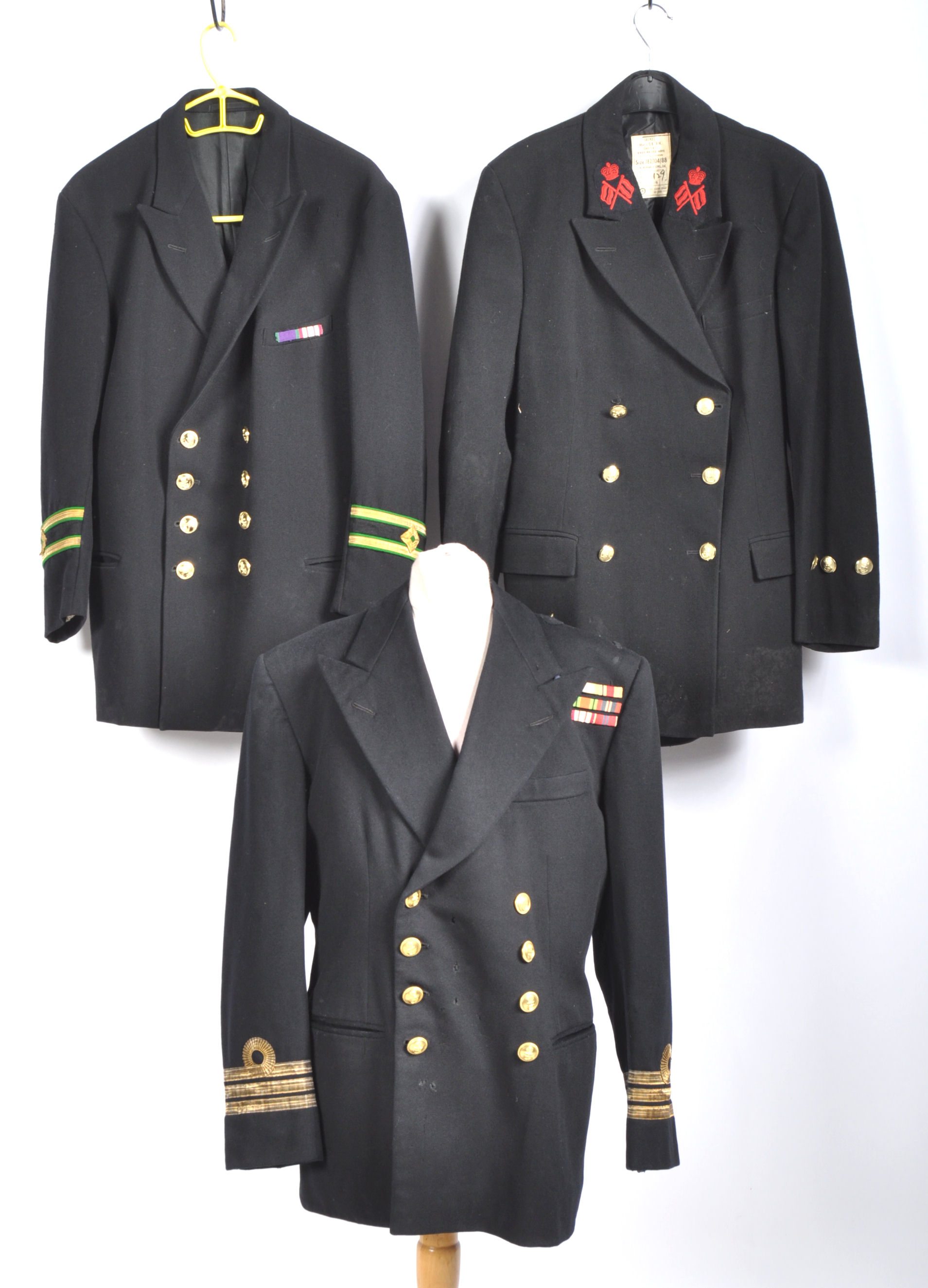 UNIFORMS & FANCY DRESS - A COLLECTION OF THREE BRITISH ROYAL NAVY UNIFORM JACKETS.