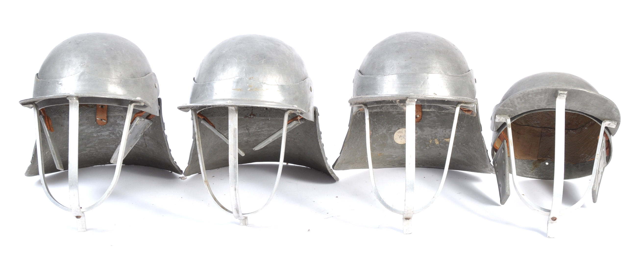 UNIFORMS AND FANCY DRESS - A COLLECTION OF FOUR MEDIEVAL KNIGHTS HELMETS.