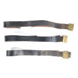 UNIFORM AND FANCY DRESS - A GROUP OF THREE LEATHER MILITARY STYLE BELTS.