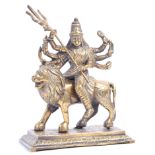 19TH CENTURY INDIAN BRASS FIGURINE OF DURGA ON LIO