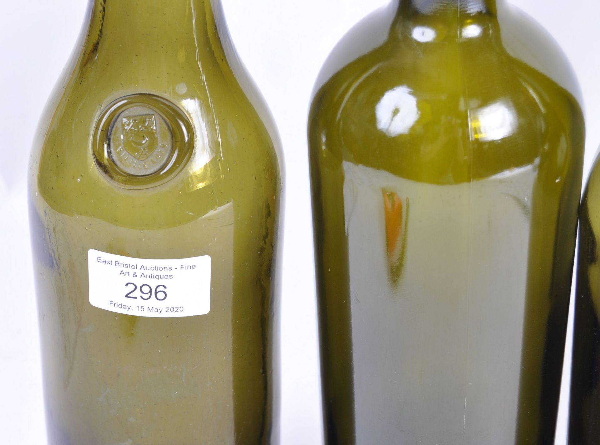 COLLECTION OF FOUR ANTIQUE GLASS WINE BOTTLES