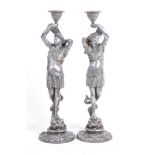 PAIR OF 19TH CENTURY POLISHED SPELTER FIGURAL CANDLESTICKS