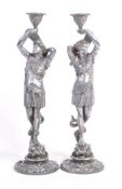 PAIR OF 19TH CENTURY POLISHED SPELTER FIGURAL CANDLESTICKS