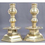 A PAIR OF 18TH CENTURY GEORGIAN ENGLISH HEAVY BRASS TABLE CANDLESTICKS