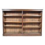 A 19TH CENTURY VICTORIAN OAK LOW AND LONG BOOKCASE