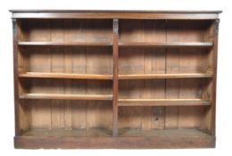 A 19TH CENTURY VICTORIAN OAK LOW AND LONG BOOKCASE