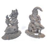 PAIR OF 19TH CENTURY PUNCH AND JUDY CAST IRON DOOR STOPS