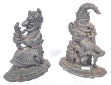 PAIR OF 19TH CENTURY PUNCH AND JUDY CAST IRON DOOR STOPS
