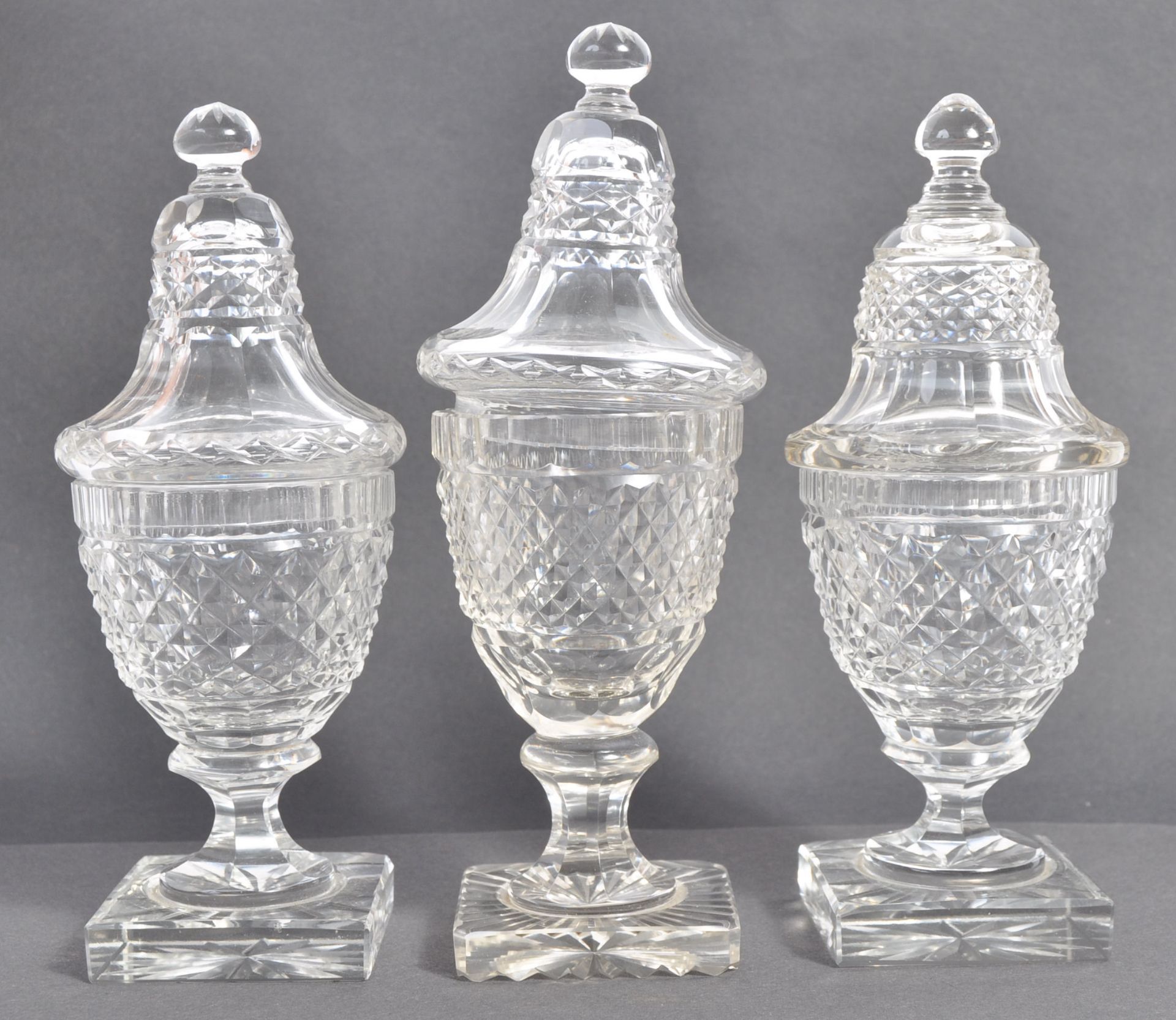 SET OF THREE EARLY 19TH CENTURY ANTIQUE GLASS LIDDED URNS