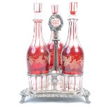 THREE 19TH CENTURY VICTORIAN RUBY GLASS DECANTERS