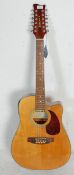 A 20th Century Legacy twelve string acoustic guita