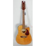 A 20th Century Legacy twelve string acoustic guita