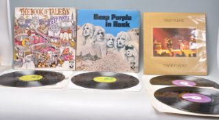 A group of three vinyl long play LP record albums