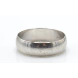 A 9ct white gold band ring. The band ring with Lon