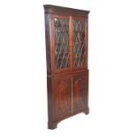 A 19th Century mahogany corner cabinet having a tw