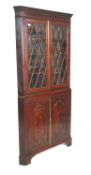 A 19th Century mahogany corner cabinet having a tw