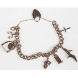 A silver charm bracelet having a heart padlock cla