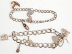 Two silver charm bracelets having silver heart pad