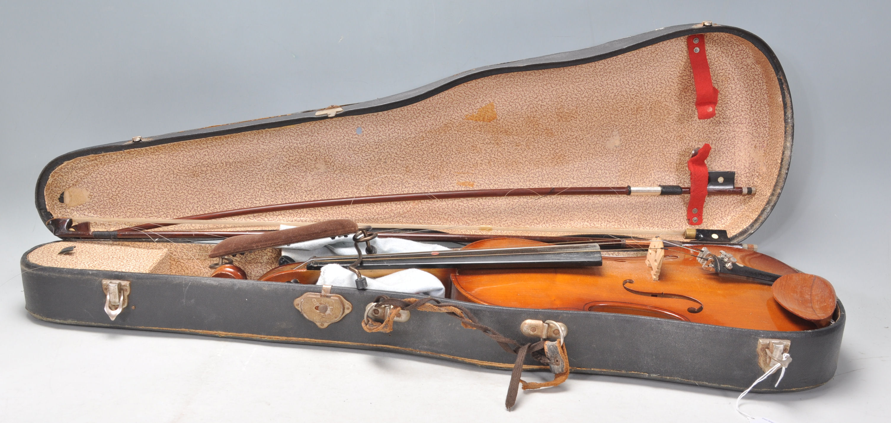 A 20th Century full size violin with two piece bac
