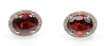 A pair of 18ct white gold stud earrings set with o