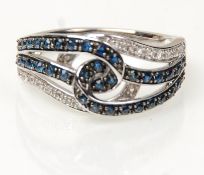 A stamped 14ct white gold knot ring set with diamo