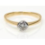 A stamped 750 18ct gold ring set with a round cut