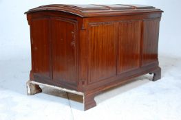 An early 20th century mahogany dome topped coffer