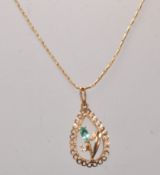 A stamped 9ct gold pendant necklace having a teard
