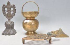 A collection of brass wares to include an antique