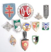 COLLECTION OF ASSORTED WWII RELATED BADGES & PATCHES