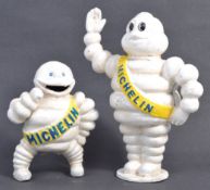 TWO MICHELIN TIRES CAST IRON BIBENDUM FIGURINES