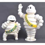 TWO MICHELIN TIRES CAST IRON BIBENDUM FIGURINES