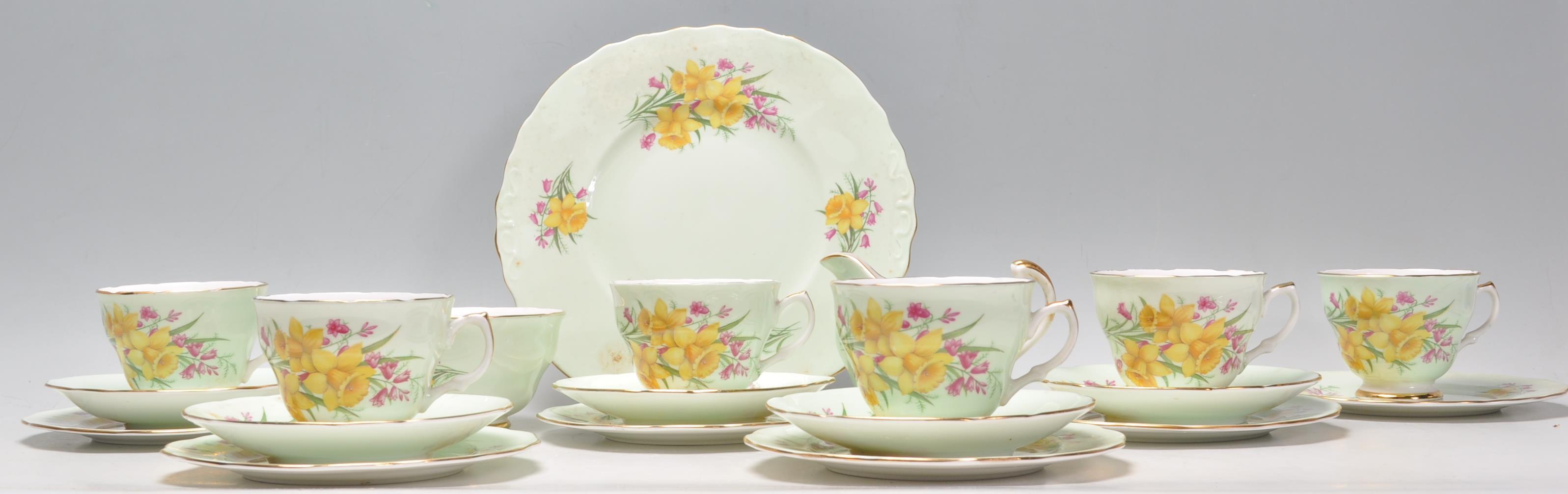An early 20th century porcelain chintz pattern by Imperial China. The set to include green ground