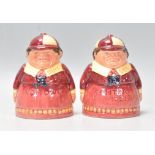 Alice In Wonderland - A pair of Royal Doulton ceramic Tweedle Dum and Tweedle Dee salt and pepper