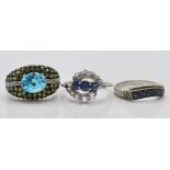 Two 9ct white gold and sapphire rings. One with white stone halo, the other being channel set.