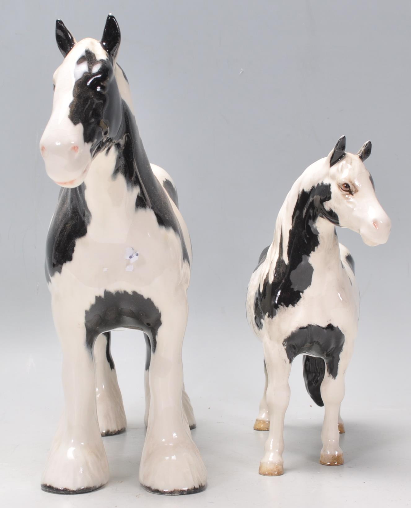 A  collection of Beswick horse porcelain figurines to include a piebald coloured shire horse and a - Image 2 of 8